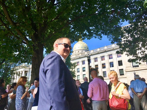 Former coal executive Don Blankenship waits outside the West Virginia Capitol on Wednesday, Aug. 29, 2018, after the Capitol was evacuated due to a fire alarm in Charleston, W.Va. The alarm interrupted a hearing for Blankenship in the state Supreme Court over whether he could be placed on the fall ballot in the U.S. Senate race. (AP Photo/John Raby)