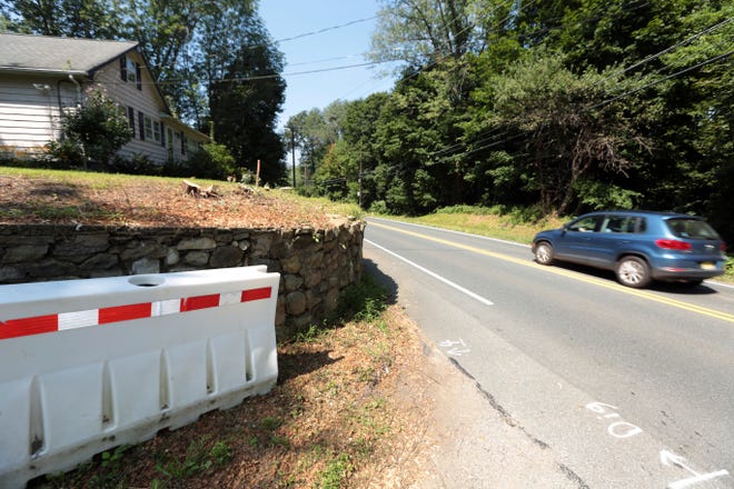 Photo by Daniel Freel/New Jersey Herald - Glen Road in Sparta at the intersection of Walnut Road, seen here Tuesday, will be reduced to one lane during repair work on a stone retaining wall. The intersection into Walnut Road will be closed to all traffic.