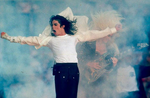 FILE - In this Jan. 31, 1993, file photo, Michael Jackson performs during the halftime show at the Super Bowl XXVII in Pasadena, Calif. Jackson’s estate and IMAX are partnering to digitally remaster “Michael Jackson’s Thriller 3D” into IMAX 3D. The partnership was announced Wednesday, Aug. 29, 2018, which would have been the singer’s 60th birthday. It will be released in IMAX theaters across the U.S. for one week beginning on Sept. 21. (AP Photo/Rusty Kennedy, File)