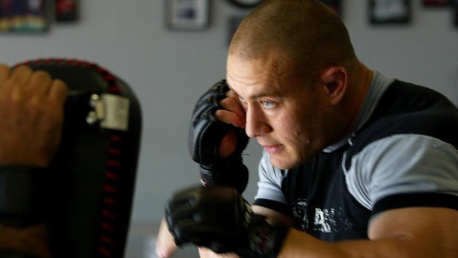 Eric Swiger, a deputy with the Palm Beach County Sheriff's Office, is seen here in 2007 training at a Loxahatchee gym. [The Palm Beach Post/2007 file photo]
