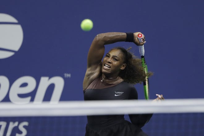 Serena Williams, of the United States, returns a shot to Magda Linette, of Poland, during the first round of the U.S. Open tennis tournament on Monday in New York. ESPN will broadcast the tournament at noon Thursday. [Jason DeCrow/Associated Press]