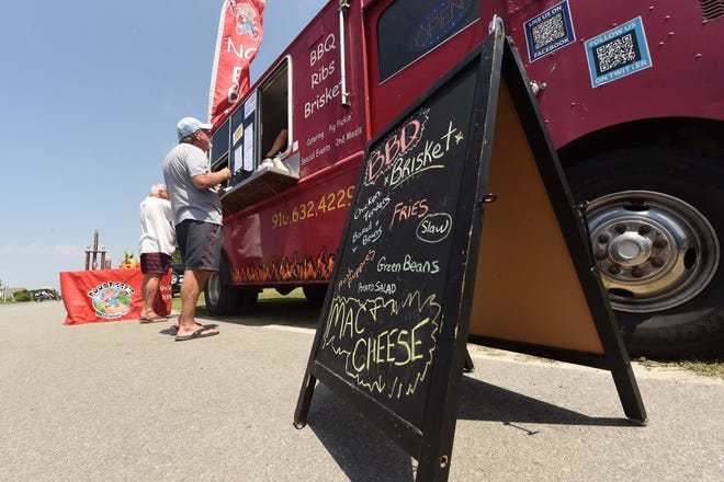 Poor Piggy's food truck was one of four to file a lawsuit against the town of Carolina Beach regarding an ordinance they said kept them from doing business in the town. The ordinance was overturned by town council Tuesday. [STARNEWS FILE PHOTO]