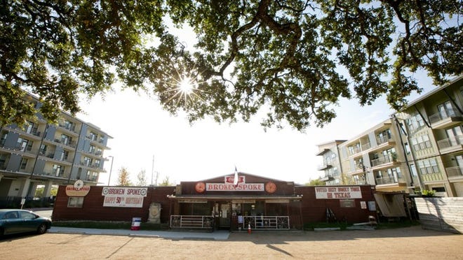 The Broken Spoke is now flanked by mixed-use developments. When the land was sold, potential buyers were asked to promise to leave the Spoke intact. So far, they have.
