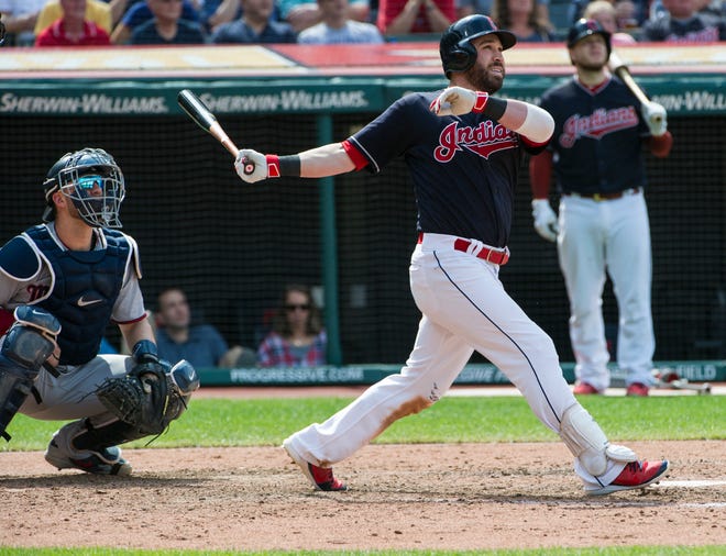 Cleveland Indians' Jason Kipnis watches his three-run home run off Minnesota Twins relief pitcher Alan Busenitz as Twins catcher Mitch Garver looks on during the sixth inning of a baseball game in Cleveland, Thursday, Aug. 30, 2018. (AP Photo/Phil Long)