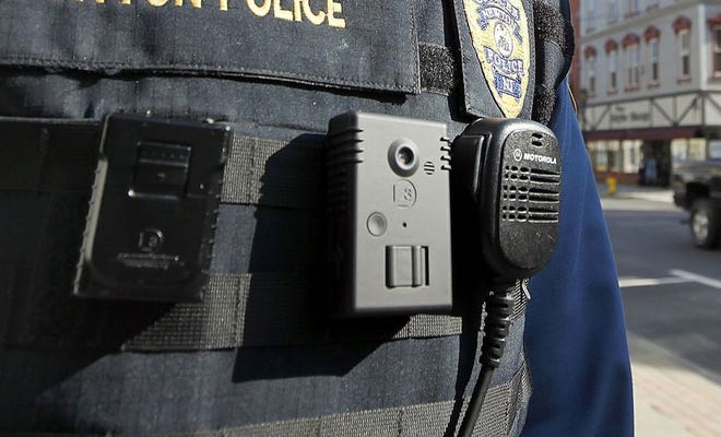 New Jersey Herald file photo - Newton police officers began using body cameras, pictured at center, in 2016. Following a decision by a state judge in Mercer County last week, police agencies are required to release their officers' body-worn camera recordings