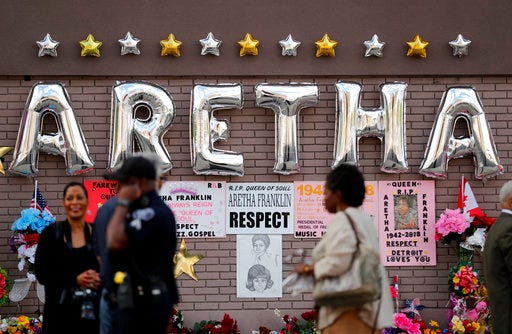 People gather outside New Bethel Baptist Church before a viewing for Aretha Franklin, Thursday, Aug. 30, 2018, in Detroit. Franklin died Aug. 16, 2018 of pancreatic cancer at the age of 76. (AP Photo/Jeff Roberson)