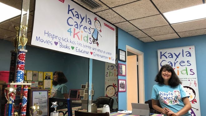 Kayla Abramowitz, founder and Chief Kid Officer of Kayla Cares 4 Kids, poses for a photo in the charity’s new office in North Palm Beach on Wednesday, Aug. 29, 2018. (Sarah Peters/The Palm Beach Post)