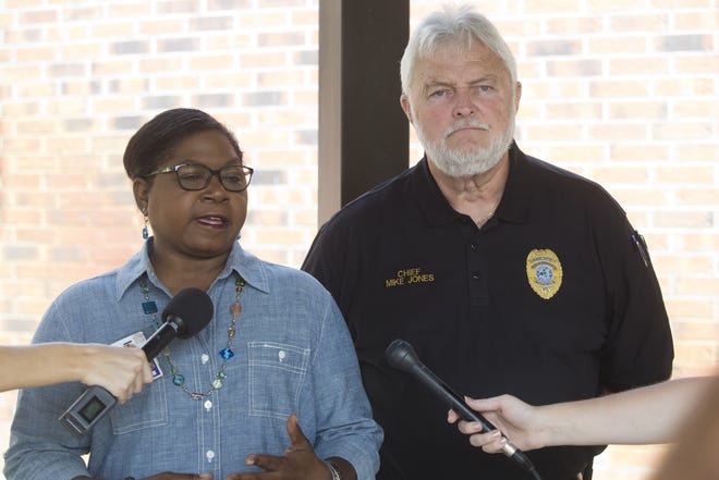 Merritt Brown Middle School principal Charlotte Marshall and Chief Mike Jones speak to reporters on Thursday. [JOSHUA BOUCHER/THE NEWS HERALD]