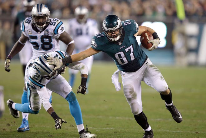 Philadelphia Eagles' Brent Celek (87) tries to break a tackle by Carolina Panthers' Thomas DeCoud (21) during the second half of an NFL football game, Monday, Nov. 10, 2014, in Philadelphia. (AP Photo/Michael Perez)