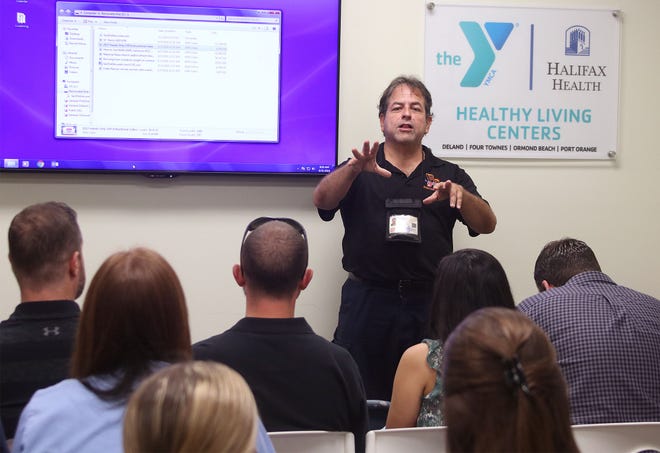 Retired firefighter and paramedic Luis Garcia trains a group of nurses and pharmacy workers how to use Narcan at the Volusia Flagler Family YMCA in Port Orange. [News-Journal/Jim Tiller]