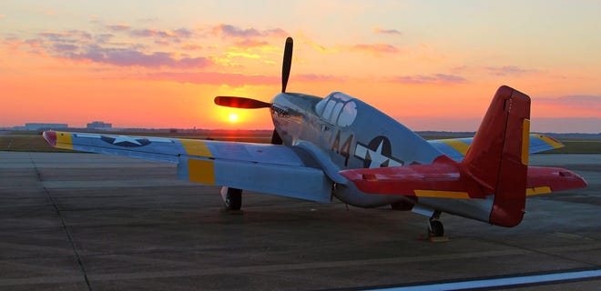 Visitors to the Rise Above traveling exhibit about the Tuskegee Airmen at the Erie Airport this weekend can see a restored P-51C Mustang up close, complete with the group's distinct red tail. [CONTRIBUTED PHOTO]