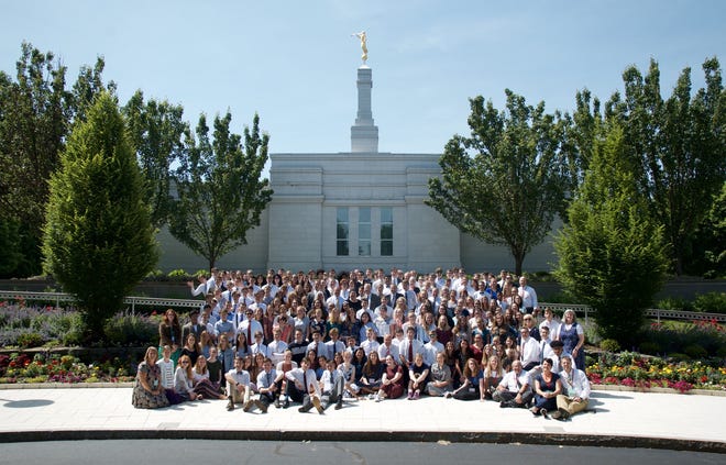 Youth and leaders in front of Palmyra, New York LDS Temple [PROVIDED PHOTO]