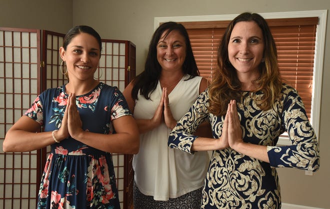Owners, from left, Nicole Barry, Jessica Andrade, and Clare O'Brien are seen at Light House Mind, Body, Spirit Sanctuary, Wednesday, Aug. 29, in Somerset. [Herald News Photo | Jack Foley]