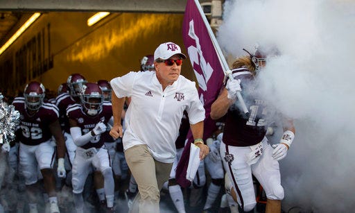 Texas A&M coach Jimbo Fisher leads the Aggies onto Kyle Field for an NCAA college football game against Northwestern State on Thursday, Aug. 30, 2018, in College Station, Texas. (AP Photo/Sam Craft)