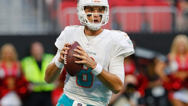 Brock Osweiler of the Miami Dolphins runs the offense against the Atlanta Falcons.