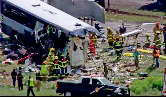 This photo from video provided by KQRENews13 shows first responders working the scene of a collision between a Greyhound passenger bus and a semi-truck on Interstate 40 near the town of Thoreau, N.M., near the Arizona border, Thursday, Aug. 30, 2018. Multiple people were killed and others were seriously injured. Officers and rescue workers were on scene but did not provide details about how many people were killed or injured, or what caused the crash.