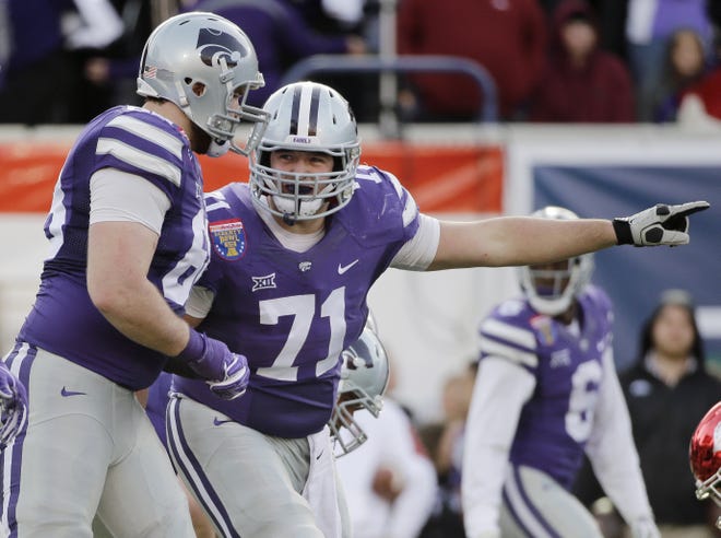 Offensive tackle Dalton Risner, center, and the Kansas State Wildcats are taking a businesslike approach to Saturday's season opener against South Dakota. [FILE PHOTOGRAPH/THE ASSOCIATED PRESS]