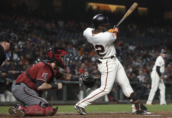 San Francisco Giants' Andrew McCutchen follows through on an RBI single against the Arizona Diamondbacks on Wednesday. McCutchen may be a member of the Yankees by the end of Friday, according to a report. [The Associated Press]