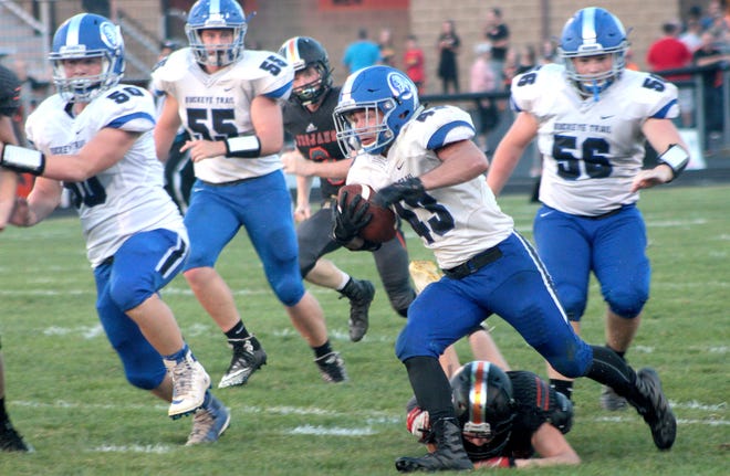 Buckeye Trail High's Marcus Masters (43) carries the ball toward the end zone during Friday's game against Newcomerstown at Lee Stadium. Also pictured are Buckeye Trail's Aiden Snodgrass (50), Josh Green (55) and Nic Burris (56).