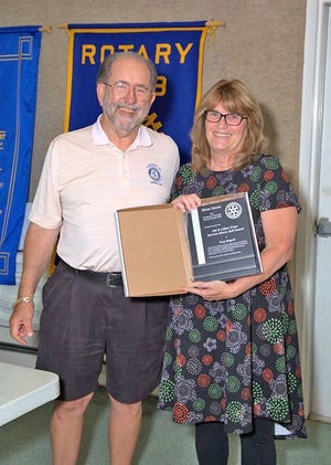 Jon Harpst of the Coldwater Township Sunrise Rotary Foundation presents Terry Boguth with the silver level of the “Hal & Lillian Creal Service Above Self” award. Congratulations Terry.