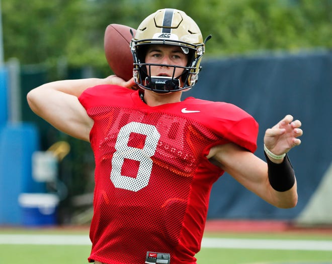 FILE - In this Aug. 9, 2018, file photo, Pittsburgh quarterback Kenny Pickett (8) passes in a drill during an NCAA college football practice in Pittsburgh. Pittsburgh head coach Pat Narduzzi says sophomore quarterback Kenny Pickett doesn't have to think he's "Kenny Perfect." Either way, Pickett will be the focal point for Pitt when the Panthers open the 2018 season on Saturday against Albany. (AP Photo/Keith Srakocic, File)