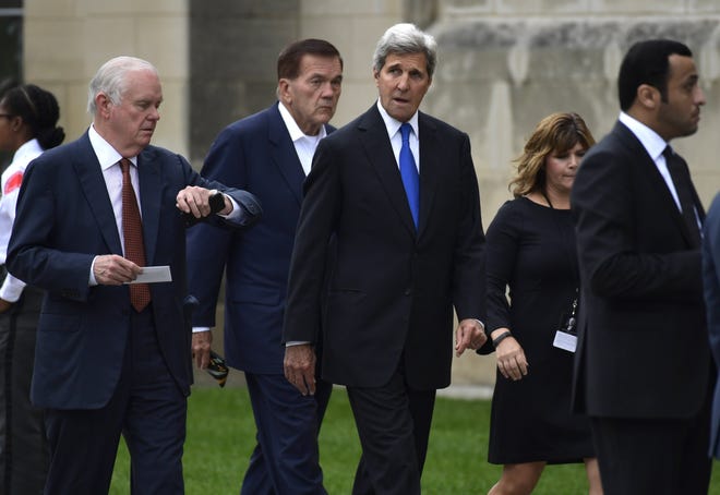 Former Secretary of State John Kerry, center, and former Pennsylvania Governor and Homeland Security Secretary Tom Ridge, second from left, arrive to attend a memorial service for Sen. John McCain, R-Ariz., at the Washington National Cathedral in Washington, Saturday morning. McCain died Aug. 25 from brain cancer at age 81. [ASSOCIATED PRESS]