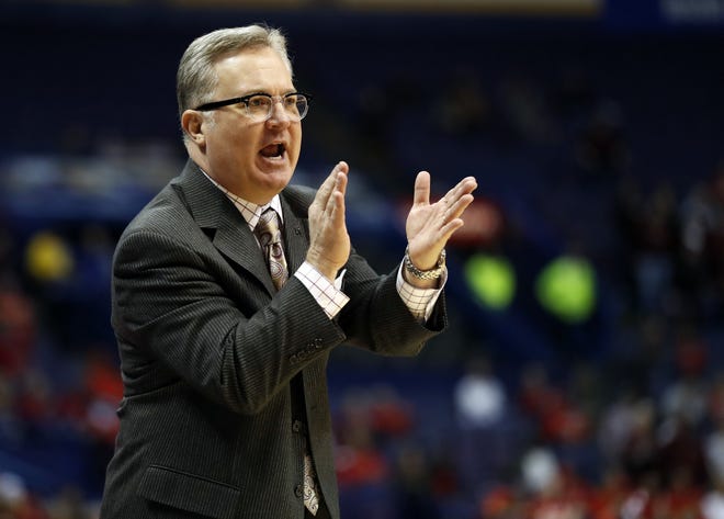 Southern Illinois head coach Barry Hinson is seen on the sidelines during the first half of an NCAA college basketball game against Loyola Chicago in the quarterfinals of the Missouri Valley Conference men's tournament Friday, March 3, 2017, in St. Louis. (AP Photo/Jeff Roberson)
