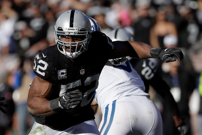 FILE - In this Dec. 24, 2016, file photo, Oakland Raiders defensive end Khalil Mack (52) rushes against the Indianapolis Colts during an NFL football game in Oakland, Calif. The Raiders exercised the fifth year option of Mack, the team announced Thursday, APril 20, 2017. The reigning Defensive Player of the Year has compiled double-digit sacks each of the past two seasons. (AP Photo/Marcio Jose Sanchez, File)