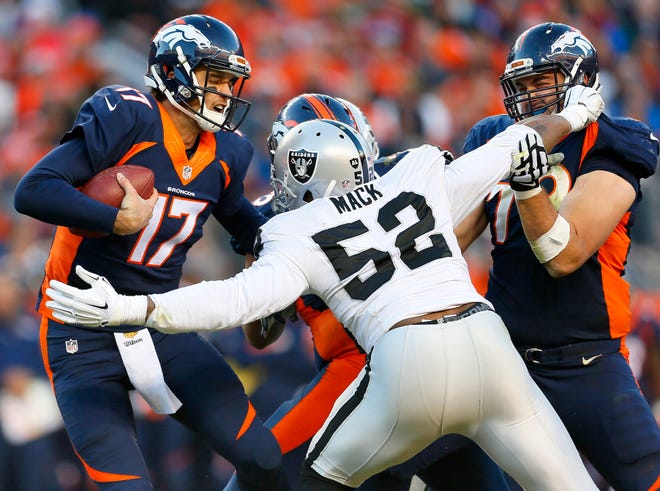 FILE - In this Dec. 13, 2015, file photo, Denver Broncos quarterback Brock Osweiler (17) is sacked by Oakland Raiders defensive end Khalil Mack (52) during the second half of an NFL football game in Denver.