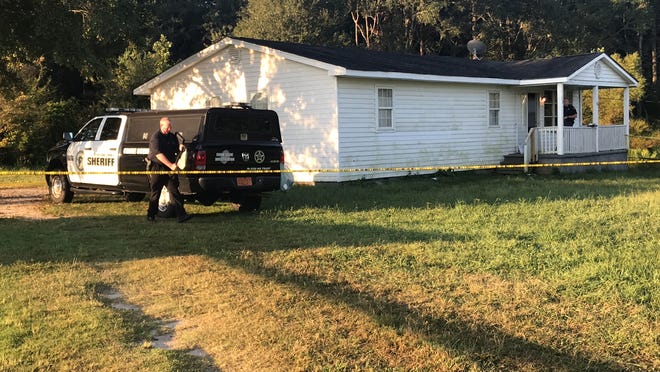 Investigators with the Cleveland County Sheriff's Office investigate a homicide at a home on Byron Place. [Joyce Orlando/The Star]