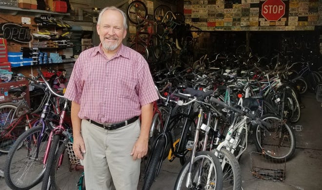 Stanley Namowicz is pictured with nearly 100 bikes that have been donated for his Bicycle Ministry. Namowicz has repaired and donated more than 20 bikes since he took over the ministry in May. [TINA ADKINS / SUN JOURNAL STAFF]