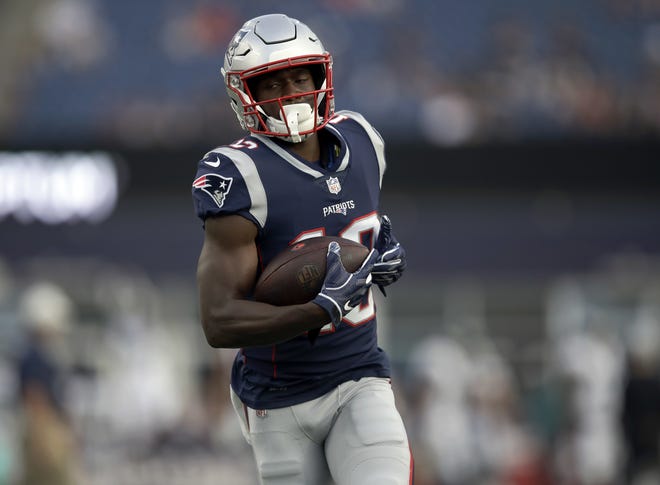 New England Patriots wide receiver Phillip Dorsett warms up before a preseason NFL football game against the Philadelphia Eagles, Thursday, Aug. 16, 2018, in Foxborough, Mass. (AP Photo/Charles Krupa)