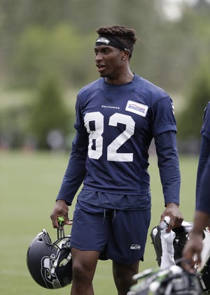 Seattle Seahawks' Amara Darboh walks off the field after an NFL football practice Thursday, June 7, 2018, in Renton, Wash. (AP Photo/Elaine Thompson)