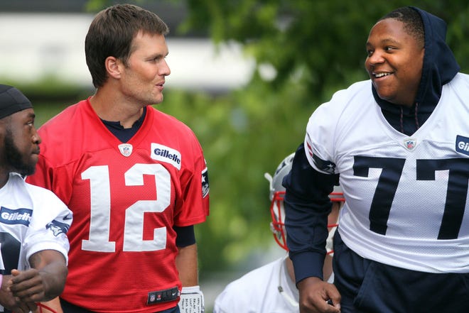 Offensive lineman Trent Brown, right, acquired from the 49ers in the offseason, will be entrusted with protecting quarterback Tom Brady's blindside this season.