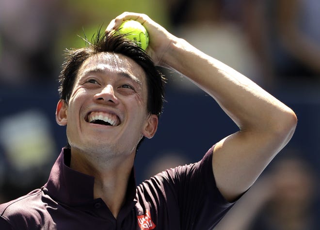 Kei Nishikori, of Japan, smiles after defeating Philipp Kohlschreiber, of Germany, during the fourth round of the U.S. Open tennis tournament, Monday, Sept. 3, 2018, in New York. (AP Photo/Kevin Hagen)