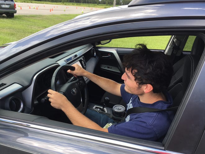 Student Mike Rodriguez is shown during the road course portion of the recent Teen Driver Challenge, a two-day driving information and safety course for 15- to 19-year-old permitted or licensed drivers, which is offered by the Marion County Sheriff's Office. The course also includes classroom instruction. [Andy Fillmore/Correspondent]