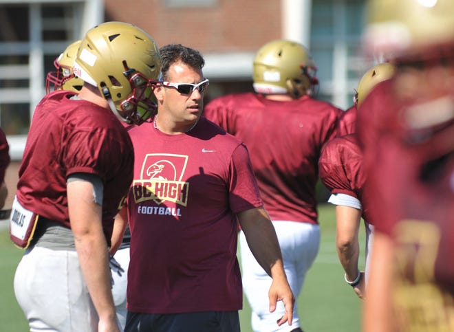 Boston College High School's new head football coach Jonathan Brillo instructs his team during practice, Monday, Sept. 3, 2018. Tom Gorman/For The Patriot Ledger