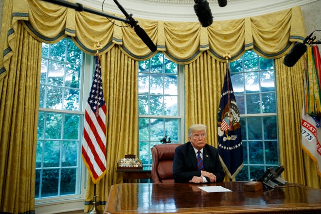 In this Aug. 27, 2018, photo, President Donald Trump listens during a phone call with Mexican President Enrique Pena Nieto about a trade agreement between the United States and Mexico, in the Oval Office of the White House. Trump is making trade policy the connective tissue that ties together his “America First” foreign policy and his political strategy for the 2020 presidential election. (AP Photo/Evan Vucci)