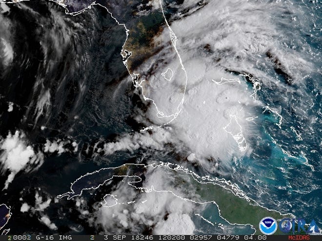 In this image released by NOAA's GOES-16 on Monday, Sept. 3, 2018, Tropical Storm Gordon appears south of Florida. The storm is expected to cross from southwest Florida into the Gulf Coast later Monday afternoon. (NOAA via AP)