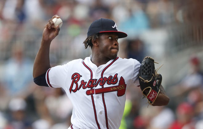 Braves starting pitcher Touki Toussaint works against the Boston Red Sox in the first inning Monday in Atlanta. [JOHN BAZEMORE/THE ASSOCIATED PRESS]