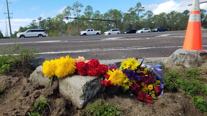 Flowers have been left at the corner of U.S. Highway 98 and Walton County Road 283 at the site where three people died in a collision earlier this weekend. [ NICK TOMECEK / DAILY NEWS ]