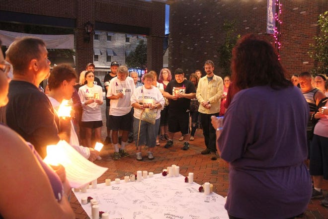 Several people attended a candlelight vigil held Friday night at Main Street Park in Waynesboro to recognize those who have lost their lives to overdose.