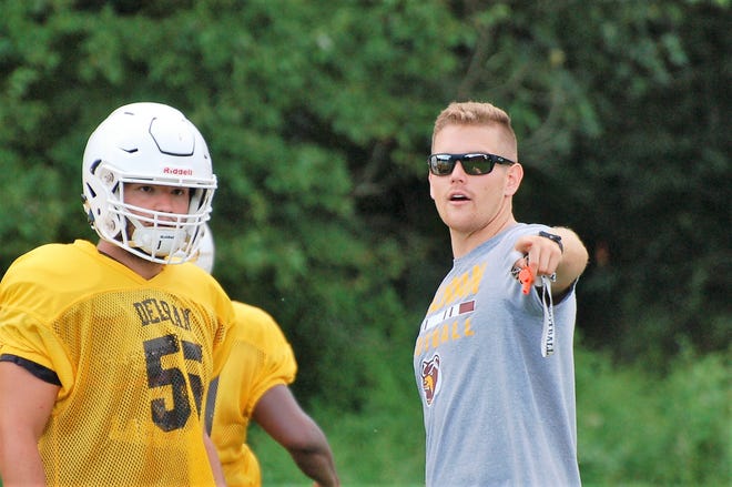 Delran first-year coach Garrett Lucas, right, explains a play during a preseason practice. The Bears open the 2018 season at Bishop Eustace on Sept. 7. [TOM RIMBACK / STAFF PHOTOJOURNALIST]