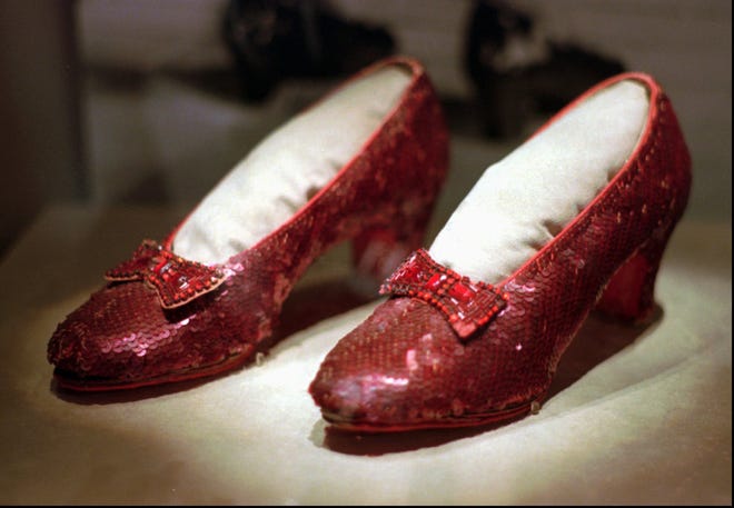 This April 10, 1996, file photo shows one of the four pairs of ruby slippers worn by Judy Garland in the 1939 film "The Wizard of Oz" on display during a media tour of the "America's Smithsonian" traveling exhibition in Kansas City, Mo. Federal authorities say they have recovered a pair of ruby slippers worn by Garland that were stolen from the Judy Garland Museum in Grand Rapids, Minn., in August 2005 when someone went through a window and broke into the small display case. The shoes were insured for $1 million. (AP Photo/Ed Zurga, File)