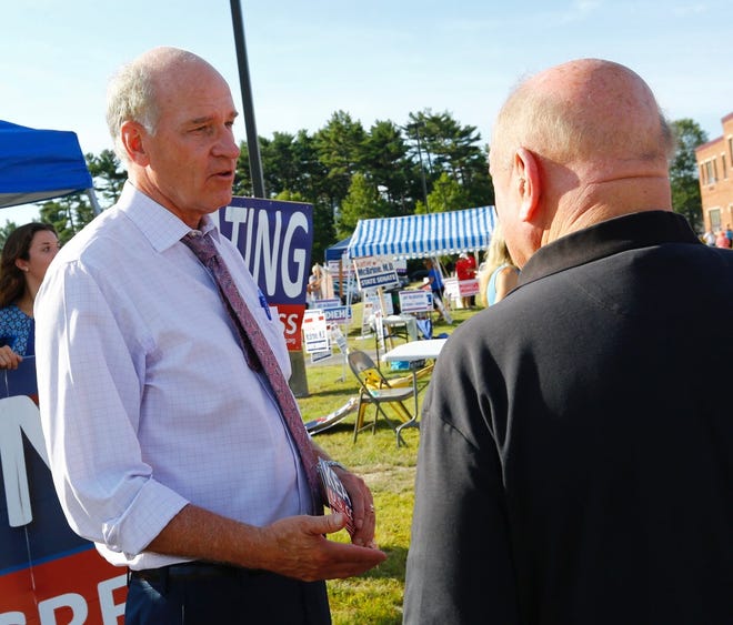 Congressman William Keating talks with a voter outside Furnace Brook School in Marshfield on Tuesday, Sept. 4, 2018. He is facing a challenge from William Cimbrello of Osterville. (Greg Derr/The Patriot Ledger)