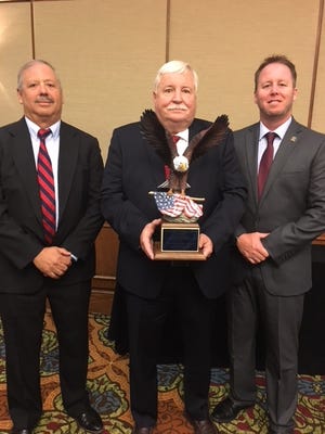CNT Deputy Director Mike Izzo, CNT Director Everett Ragan, CNT Assistant Deputy Director Gene Harley accept the Joseph Whitehead award during the Georgia Narcotics Officers' Association 2018 conference. [Courtesy of CNT]