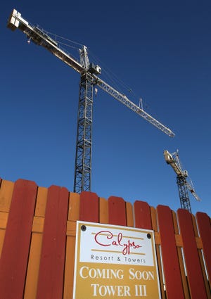 Cranes stand at the site of the upcoming third Calypso tower on Front Beach Road in Panama City Beach, which is considering a change in height incentives. [NEWS HERALD FILE PHOTO]