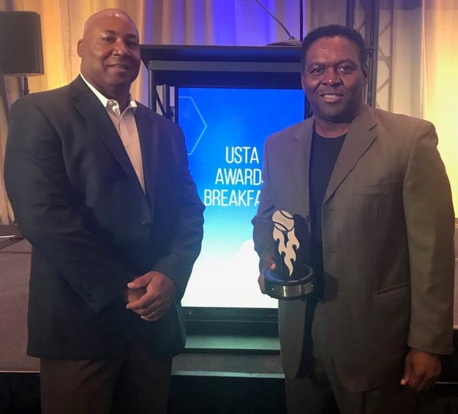 Michael Harden, the president and CEO of MACH Academy, and Henry Taylor, the academy's vice president, accepted the National Junior Tennis and Learning Chapter of the Year Award from the United States Tennis Association in New York City on Monday. [SPECIAL]