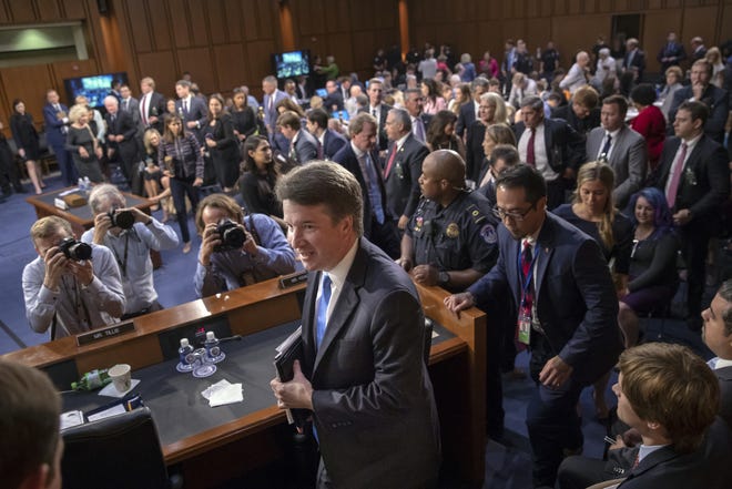 Supreme Court nominee Brett Kavanaugh leaves the Senate Judiciary Committee hearing room during a break on the second day of his confirmation hearing, on Capitol Hill in Washington, Wednesday, Sept. 5, 2018. (AP Photo/J. Scott Applewhite)