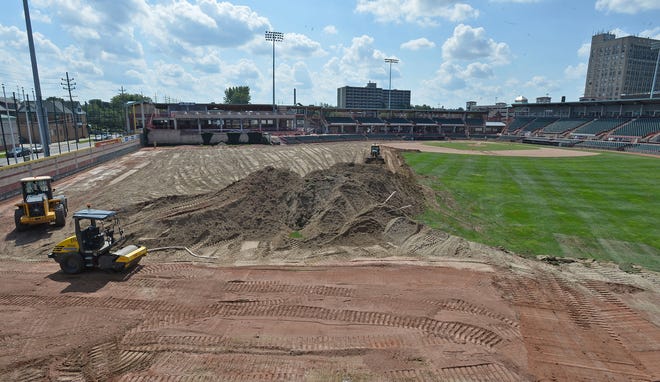 Heavy equipment tears up the turf in left field and center field at UPMC Park on Wednesday, the second day of a field replacement project at the ballpark, which is the home field for the Erie SeaWolves baseball team and is also used for high school and college games. UPMC Park hasn't had a turf replacement since 2007, according to Casey Wells, executive director of Erie Events, which manages the facility. The replacement project will cost about $500,000 and should be completed by late October. [CHRISTOPHER MILLETTE/ERIE TIMES-NEWS]
